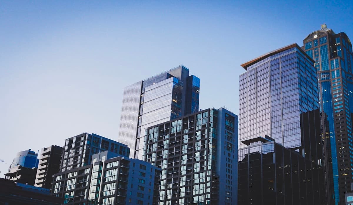 City skyline of glass towers at dusk